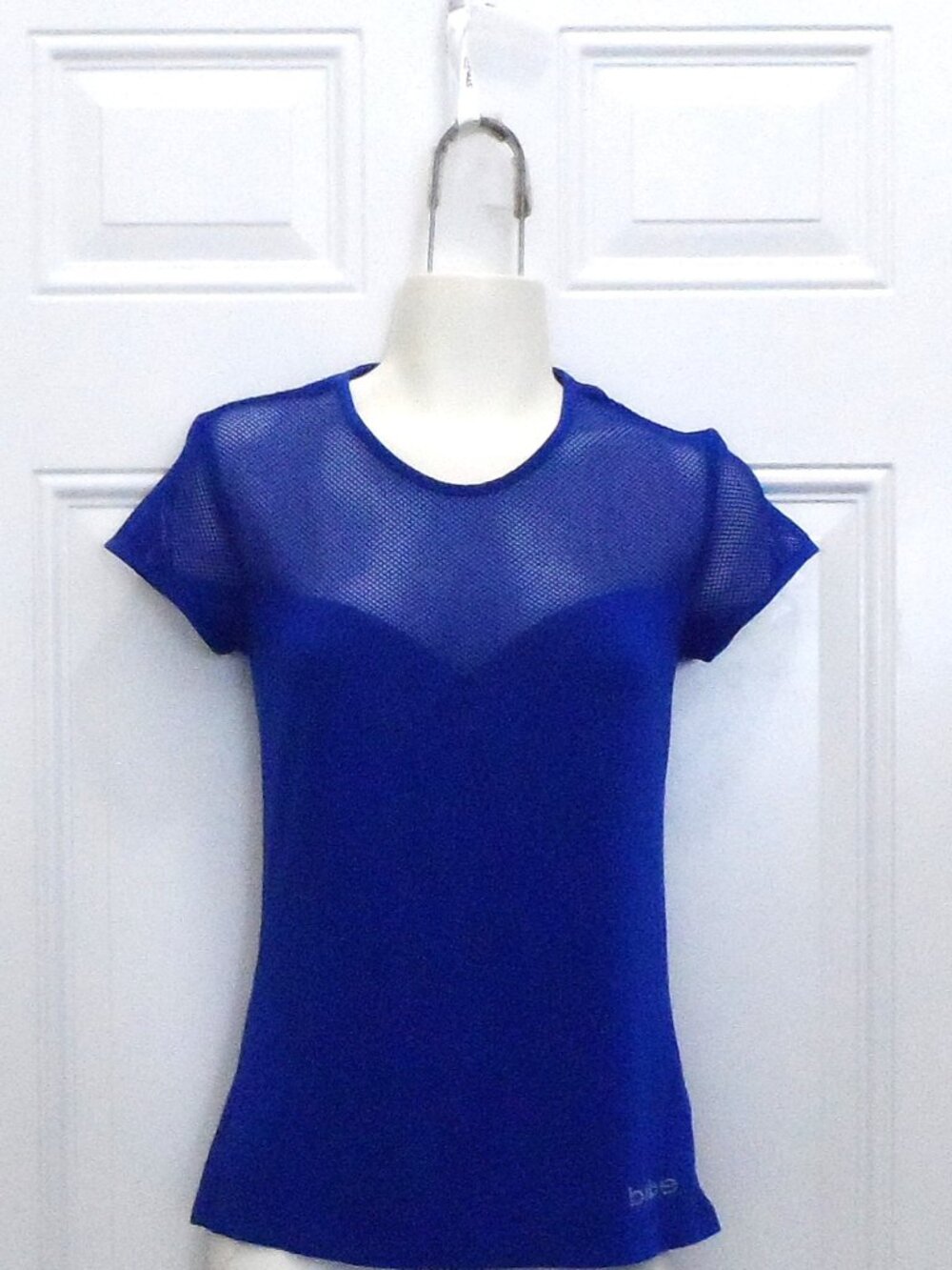Bebe- women's blue short-sleeve shirt size M